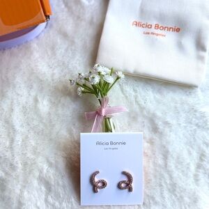 Alicia Bonnie "Show Your Love" earrings are crafted with 14K rose gold plating